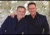 Aled Jones & Russell Watson wear blue suits and smile at the camera Aled Jones & Russell Watson wear blue suits and smile at the camera