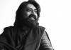Musician Talvin Singh smiles and looks off to the right. Black and white. Musician Talvin Singh smiles and looks off to the right. Black and white.