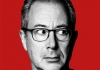 Ben Elton, photographed in black and white, against a bright red background Ben Elton, photographed in black and white, against a bright red background