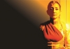 A woman in traditional Indian clothes, bathed in amber light. A woman in traditional Indian clothes, bathed in amber light.
