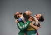 Three dancers - 2 women and 1 man - embracing and screaming in a circle Three dancers - 2 women and 1 man - embracing and screaming in a circle