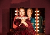 Two women (Lily James and Gillian Anderson) standing in front of a stage mirror Two women (Lily James and Gillian Anderson) standing in front of a stage mirror
