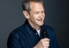 Comedian Alexander Armstrong wears a dark blue shirt and smiles whilst holding a microphone Comedian Alexander Armstrong wears a dark blue shirt and smiles whilst holding a microphone