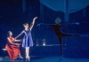 A woman in a red dress plays the piano, whilst a female ballerina dances with a projection of a male dancer A woman in a red dress plays the piano, whilst a female ballerina dances with a projection of a male dancer