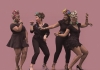 Four women dance and laugh against a pink background Four women dance and laugh against a pink background