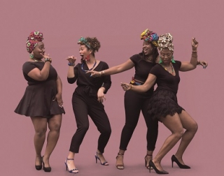 Four women dance and laugh against a pink background Four women dance and laugh against a pink background