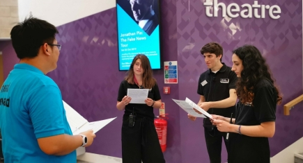 Stewards being briefed by the head stewards outside the theatre Stewards being briefed by the head stewards outside the theatre