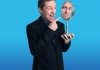 Man laughs and points to his reflection in a mirror Man laughs and points to his reflection in a mirror