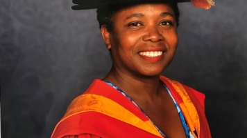 Director of Warwick Arts Centre, Doreen Foster smiles with graduation robes on Director of Warwick Arts Centre, Doreen Foster smiles with graduation robes on