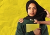 A girl in a school uniform holds her book and looks at the camera. Hands grab at her jumper and pull at her hijab. A girl in a school uniform holds her book and looks at the camera. Hands grab at her jumper and pull at her hijab.