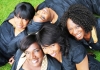 Five black women gathered on grass Five black women gathered on grass