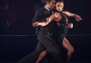 A man and woman tango dancing in black costumes A man and woman tango dancing in black costumes