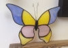 A stained glass butterfly decoration. A stained glass butterfly decoration.