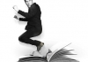 A black and white image of comedian Rhod Gilbert jumping out of a large, open book A black and white image of comedian Rhod Gilbert jumping out of a large, open book