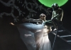A woman dances in a white dress with a frog on a ladder A woman dances in a white dress with a frog on a ladder