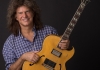Musician Pat Metheny holding a guitar Musician Pat Metheny holding a guitar