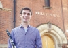 Clarinet player, Sergio Castello Lopez standing outside The Halle building Clarinet player, Sergio Castello Lopez standing outside The Halle building