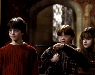 Actors Daniel Radcliffe, Rupert Grint and Emma Watson in the dark Gryffindor common room Actors Daniel Radcliffe, Rupert Grint and Emma Watson in the dark Gryffindor common room