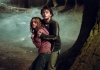Actor Daniel Radcliffe holding actress Emma Watson in a forest Actor Daniel Radcliffe holding actress Emma Watson in a forest