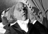 Actor John Hurt as The Elephant Man looking through a monocle Actor John Hurt as The Elephant Man looking through a monocle