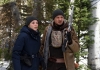 FBI Agent Jane Banner (Elizabeth Olsen) and hunter Cory Lambert (Jeremy Renner) in a snowy forest. FBI Agent Jane Banner (Elizabeth Olsen) and hunter Cory Lambert (Jeremy Renner) in a snowy forest.