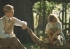 A.A.Milne (Gleeson) sits with his son Christopher Robin (Titson) and his teddy bears, resembling the characters from Winnie the Pooh A.A.Milne (Gleeson) sits with his son Christopher Robin (Titson) and his teddy bears, resembling the characters from Winnie the Pooh