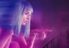 Blade Runner Officer K (Gosling) looks at a huge, digital protection of a woman with blue hair. Blade Runner Officer K (Gosling) looks at a huge, digital protection of a woman with blue hair.