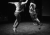 Two actors in black and white jumping Two actors in black and white jumping