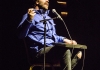 David O'Doherty sitting on stage with a keyboard on his lap David O'Doherty sitting on stage with a keyboard on his lap
