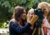 Three girls behind a camera Three girls behind a camera