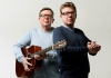 The musical duo against a white background The musical duo against a white background