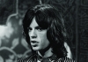 Medium shot of Mick Jagger looking off camera in black and white Medium shot of Mick Jagger looking off camera in black and white