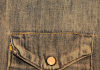 A close shot of a denim jacket's pocket A close shot of a denim jacket's pocket