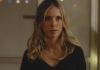 Photo of a blonde woman standing indoors with fairy lights in the background Photo of a blonde woman standing indoors with fairy lights in the background
