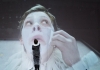 Projection of a child actor putting greasepaint on his face Projection of a child actor putting greasepaint on his face