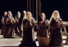 Several women dressed as nuns kneeling in prayer Several women dressed as nuns kneeling in prayer