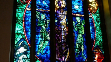 The East Window in St John’s, The Chapel, designed by John Piper and depicting Christ In Majesty – Christ as ruler of the world, flanked by saints. The East Window in St John’s, The Chapel, designed by John Piper and depicting Christ In Majesty – Christ as ruler of the world, flanked by saints.
