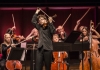 Alexander Sitkovetsky plays violin on stage Alexander Sitkovetsky plays violin on stage