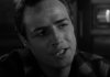 A black and white image of Marlon Brando speaking A black and white image of Marlon Brando speaking