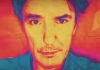 A close crop on comedian Dylan Moran, which has been coloured in oranges, pinks and blues A close crop on comedian Dylan Moran, which has been coloured in oranges, pinks and blues