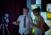A young boy and a woman observe a tablet screen on a tripod A young boy and a woman observe a tablet screen on a tripod